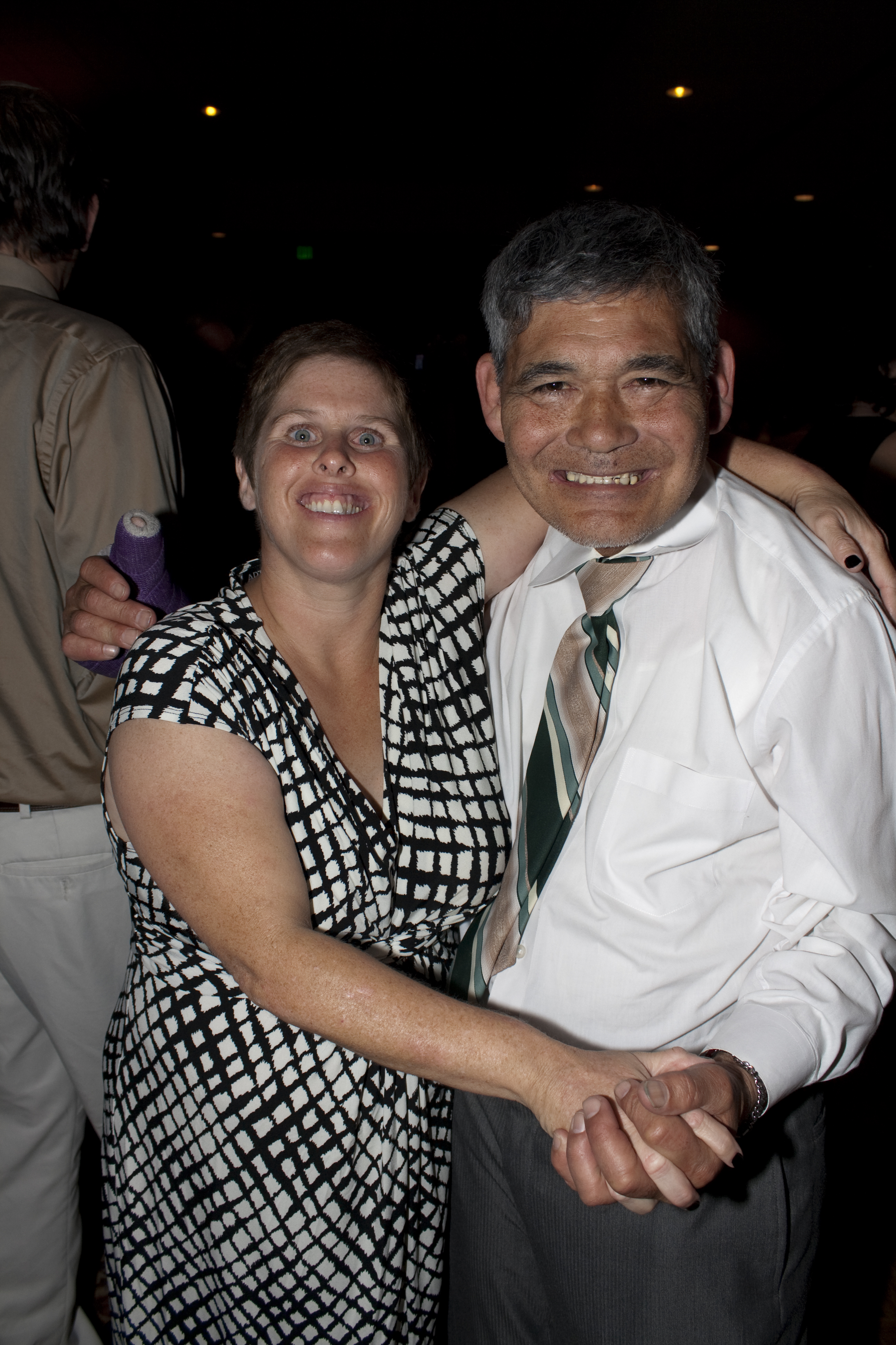 Two people dancing and smiling